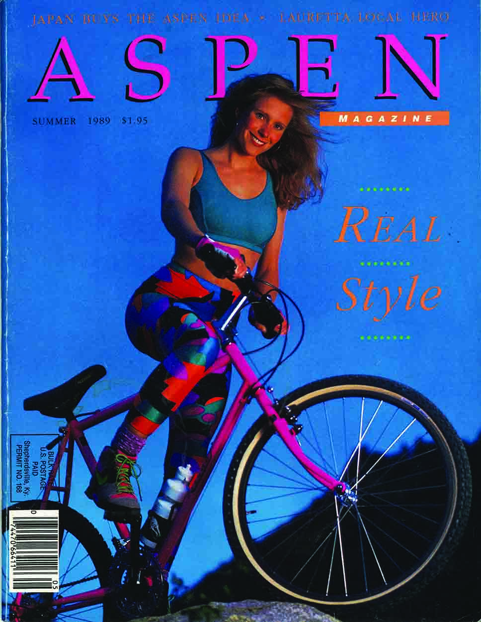 Front cover of Aspen magazine with a woman on a bicycle